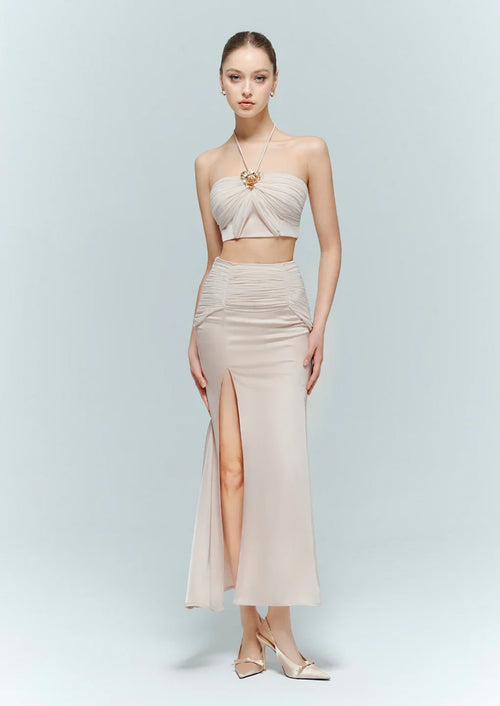 Model wearing the Aveline pink bustier styled as a dressy tops for evening wear, perfectly coordinated with the matching Dahlia maxi skirt