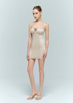 Woman modeling the Artel Retro Enpure Pink Crystal Chain Bodycon Mini Dress featuring gold floral embellishments and crystal straps