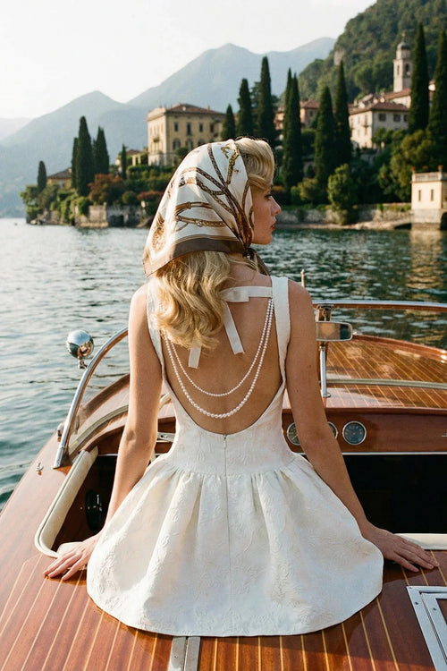 Selene cream white pearl embellished dress with an open back, styled for a vintage Euro summer aesthetic.