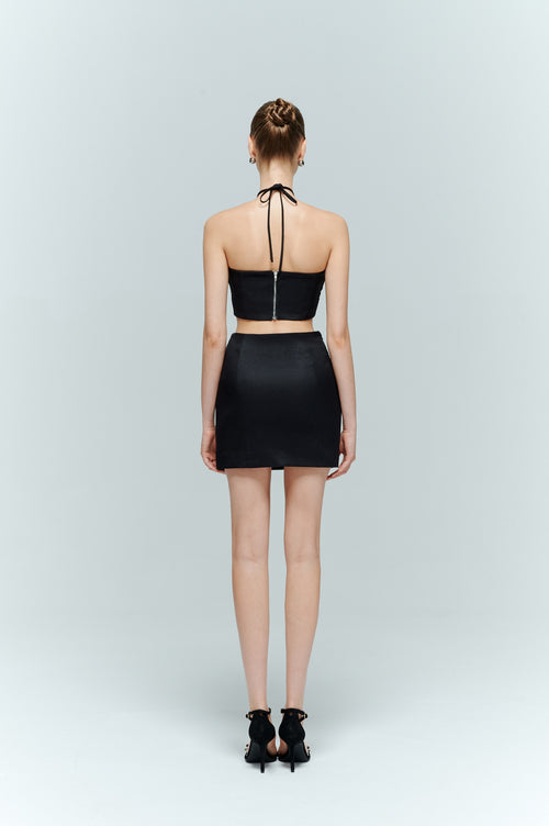 Back View of the Aveline black bustier top showing the halter neck styling