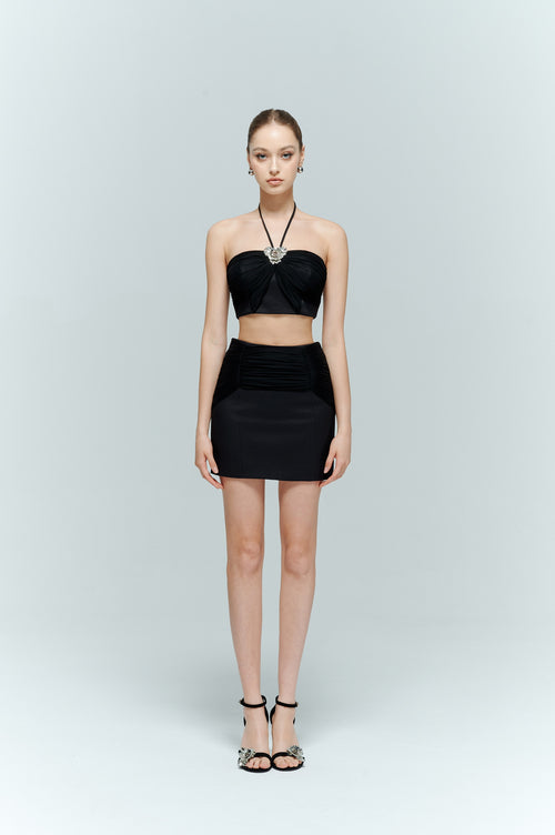 Front view of the Aveline black top worn in the convertible halter style, highlighting the neckline