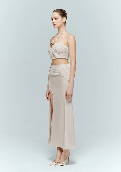 Side profile of the Aveline pink top and Dahlia maxi skirt set, showcasing a minimalist elegant dress aesthetic for evening wear