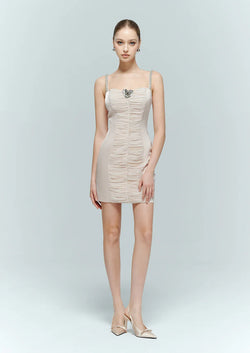 Front studio view of the Bijouelle pink ruched dress on a model, featuring a fitted silhouette, sweetheart neckline, and a floral bust detail