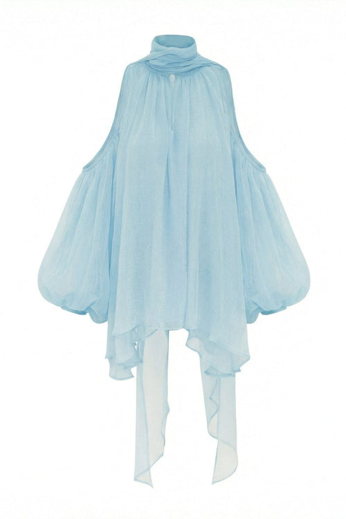 Product shot of the Aurorette light blue tulle cold shoulder top, displaying the sheer front drape, symmetrical cutouts, and high neck tie.