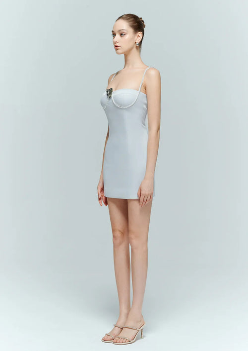 Side profile showing the flawless, form-fitting silhouette of the Enpure blue bodycon dress in a sleek mini length.