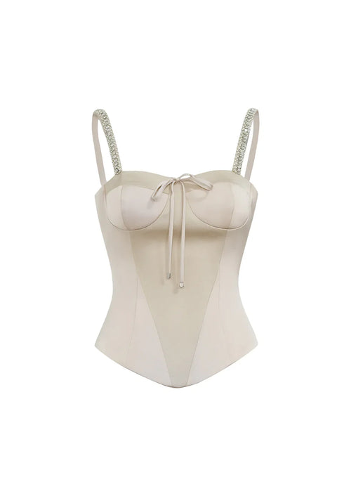 Flat lay front view of the Papillon light pink corset top on a clean background, highlighting the sweetheart neckline and structured bodice.