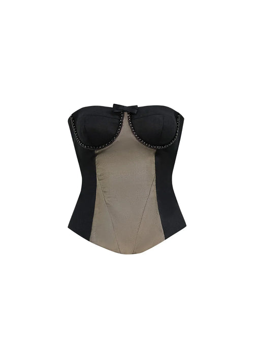 Front view of the Marcelline strapless black corset top on a white background, highlighting the central beaded bow and structured silhouette.