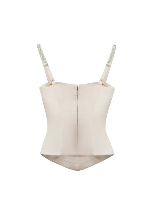 Flat lay back view of the Papillon pink bustier top on a clean background, showing the tailored construction and subtle back zipper.