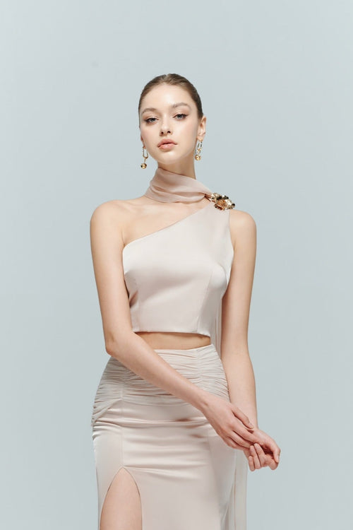 Close-up of the Seraphine top, a beautifully refined option among pink one shoulder tops, featuring a flattering neckline.