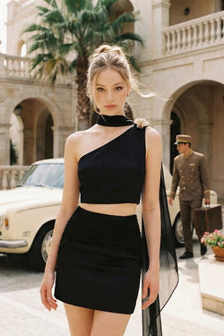 Woman wearing the Seraphine retro crop top outdoors, showcasing the midnight glamour aesthetic with a vintage backdrop.