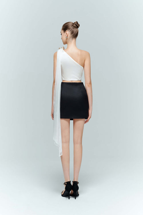Back view of the Seraphine sleeveless crop top in white, demonstrating the elegant length of the cascading floor-sweeping tulle train.