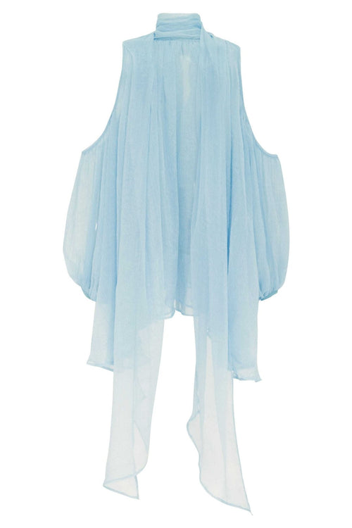 Product shot of the sheer light blue tulle summer top, highlighting the translucent fabric and signature trailing back ties