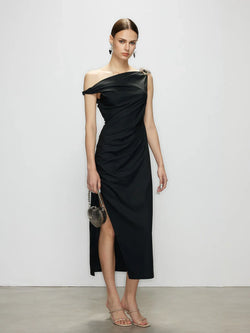 Front view of the Stellar black one shoulder maxi dress. A minimalist elegant dress by Artel Retro, featuring a chic sleeveless design and a side slit.