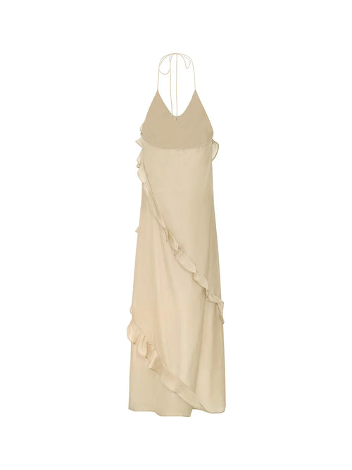 Back product shot of the Wavekiss cascading ruffle dress in beige, illustrating the timeless lines of the open back.