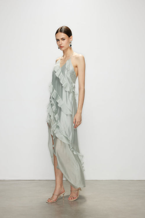 Model stepping gracefully in the Wavekiss light blue high slit dress, revealing the dramatic leg opening and sweeping asymmetrical hem.